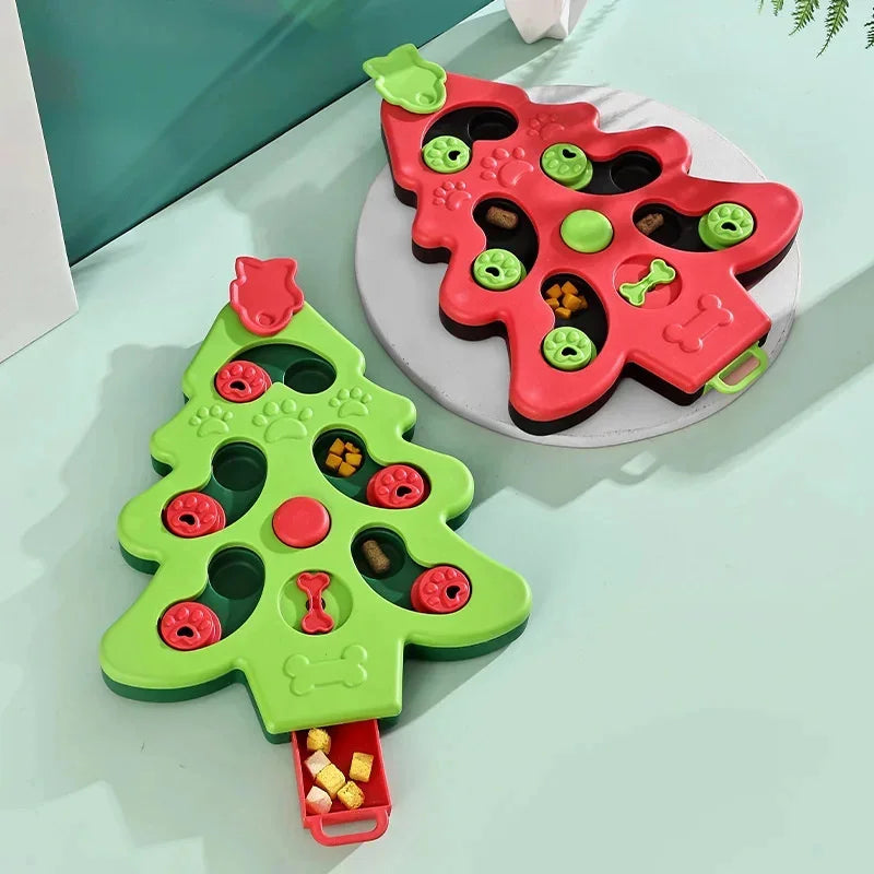 Two Christmas tree-shaped toys on a light green surface.