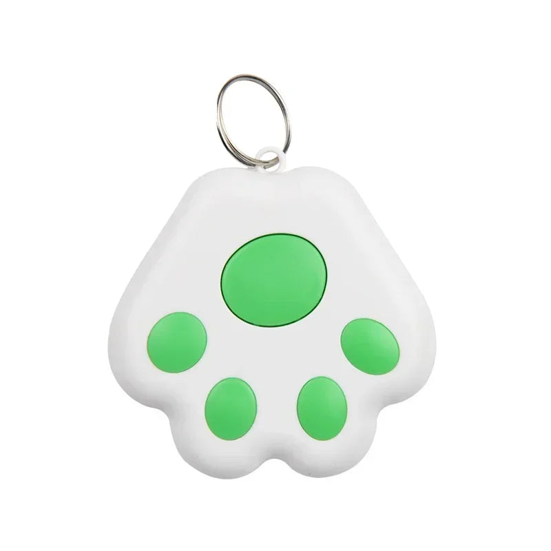 White paw-shaped keychain with green spots on a white background