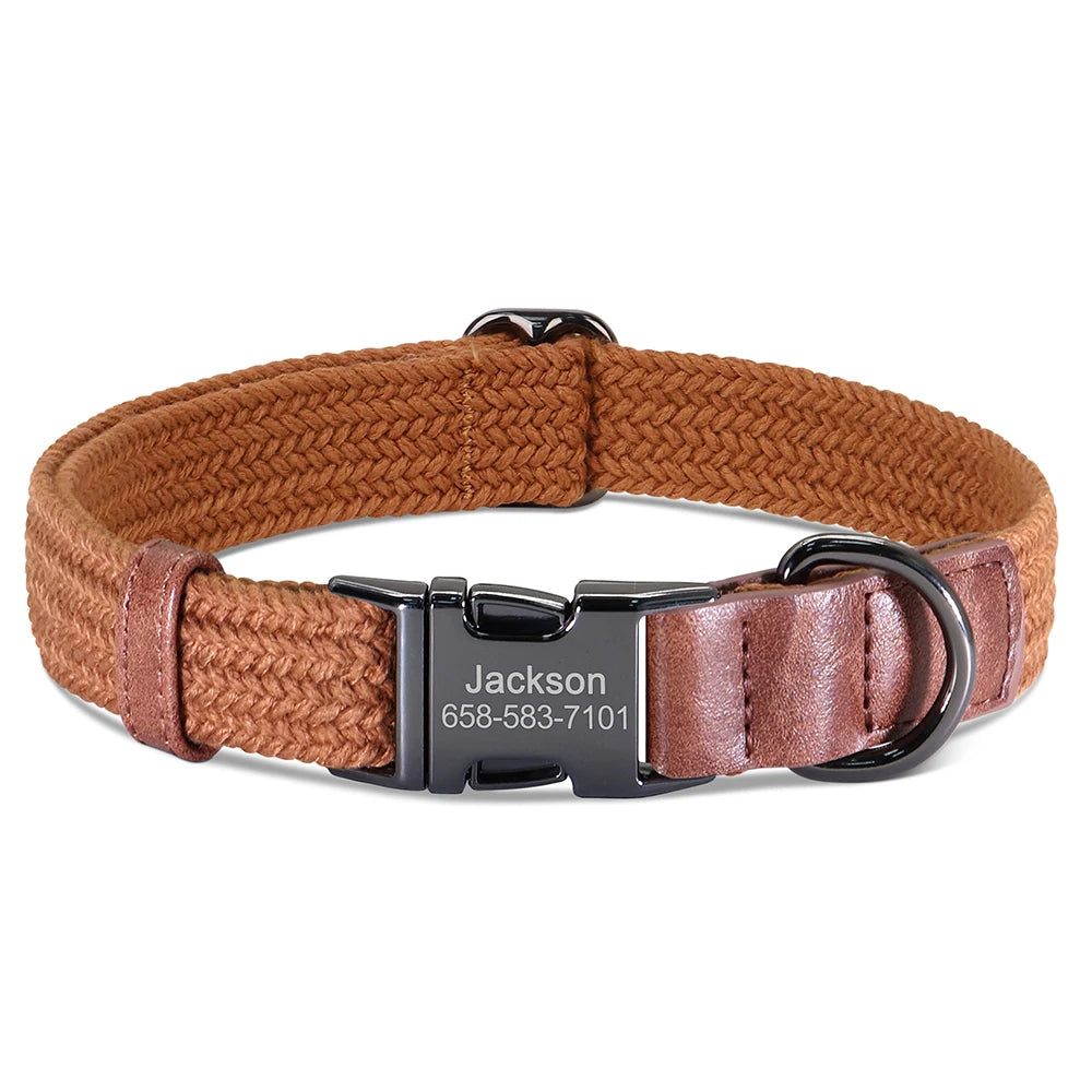 Brown dog collar with a black engraved nameplate on a white background