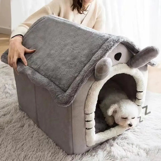 Dog lying inside a gray pet house with a fluffy interior