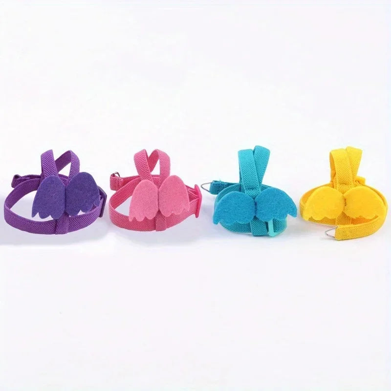 Four colorful hair clips in purple, pink, blue, and yellow on a white background