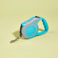 Retractable dog leash with blue handle and gray casing on a light yellow background