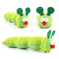 Green plush caterpillar toy with a face on a white background