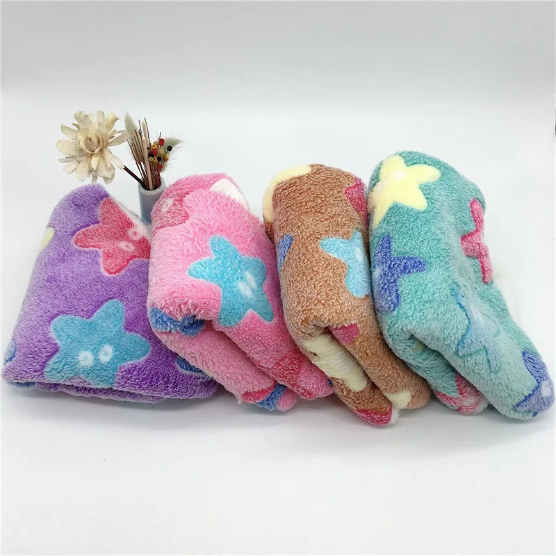 Four colorful star-shaped dog toys on a white background