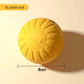 Yellow solid ball with measurement label on a beige background