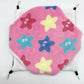 Pink hexagonal mat with star patterns on a white background