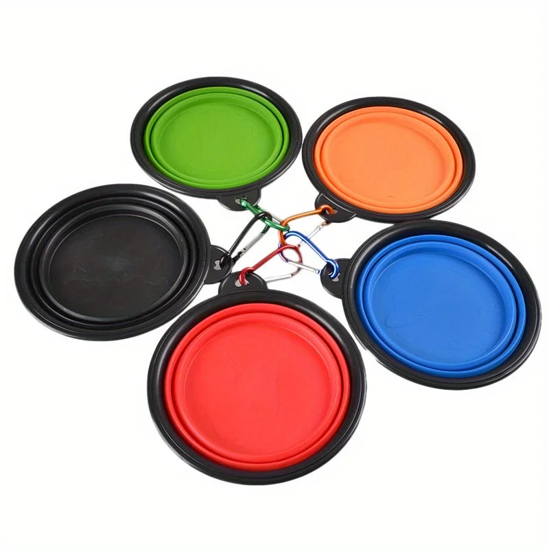 Set of five colorful collapsible dog bowls with black bases on a white background