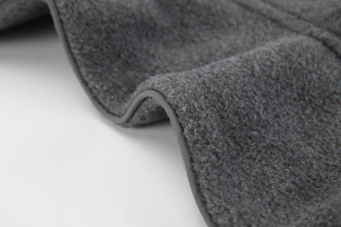 Close-up of a gray car mat on a white background