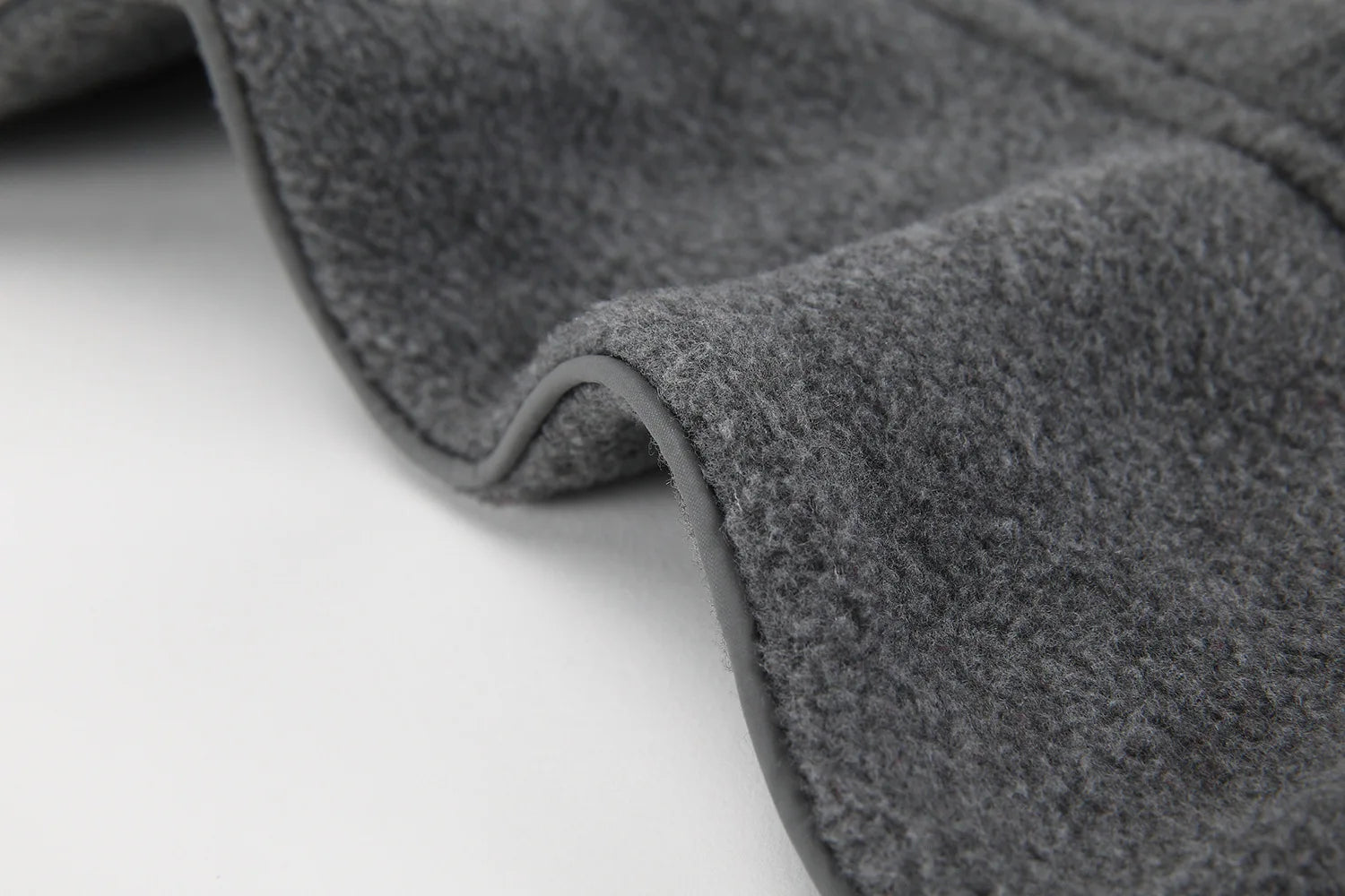 Close-up of a gray car mat on a white background