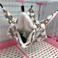 Pet hammock with plush interior in a pet cage