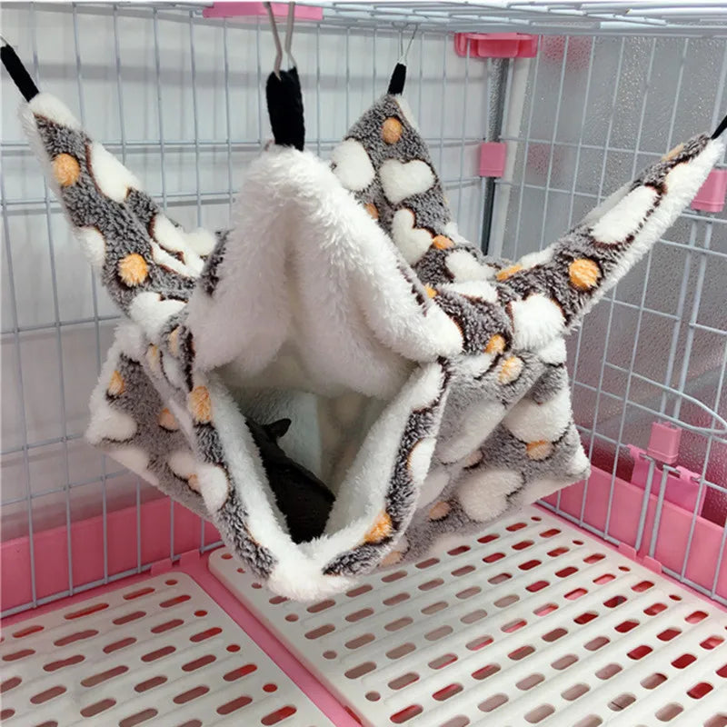 Pet hammock with plush interior in a pet cage
