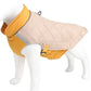 Dog wearing a yellow and beige quilted jacket on a mannequin against a white background