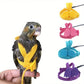 Bird wearing a yellow bird harness with colorful options displayed above on a white background