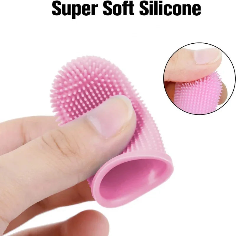 Pink silicone finger scrubber held by a hand with close-up inset showing texture.
