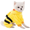 Small white dog wearing a yellow bee costume with black stripes on a white background