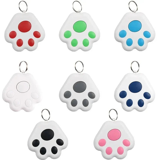 Set of colorful paw-shaped keychains on a white background
