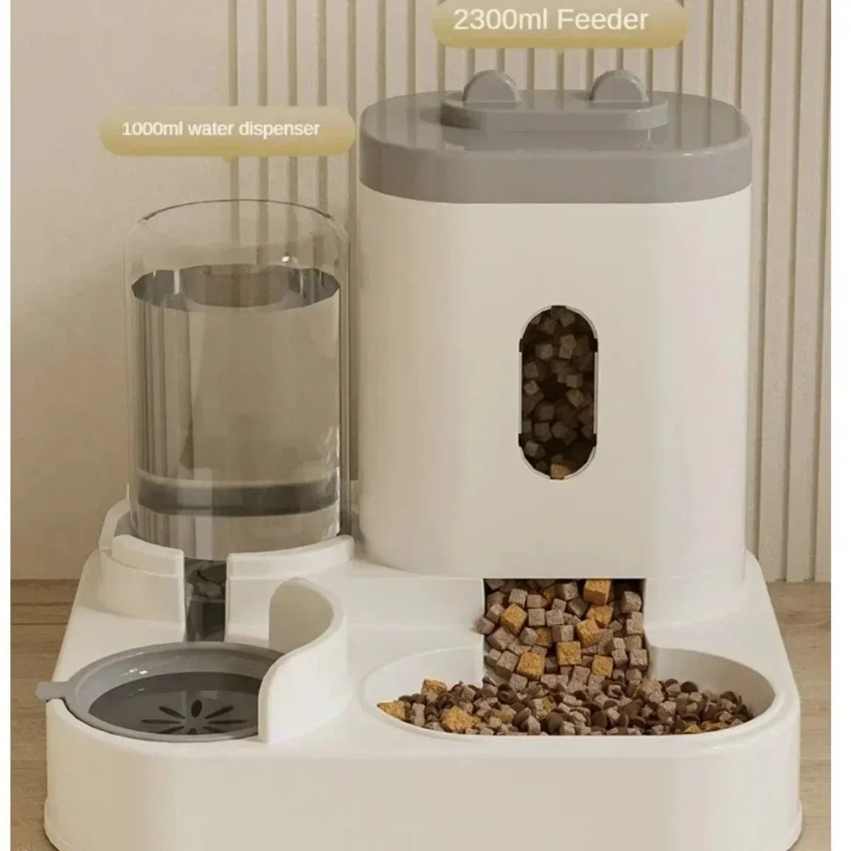Pet feeding and water dispensing station with a 2300ml feeder and 1000ml water dispenser.
