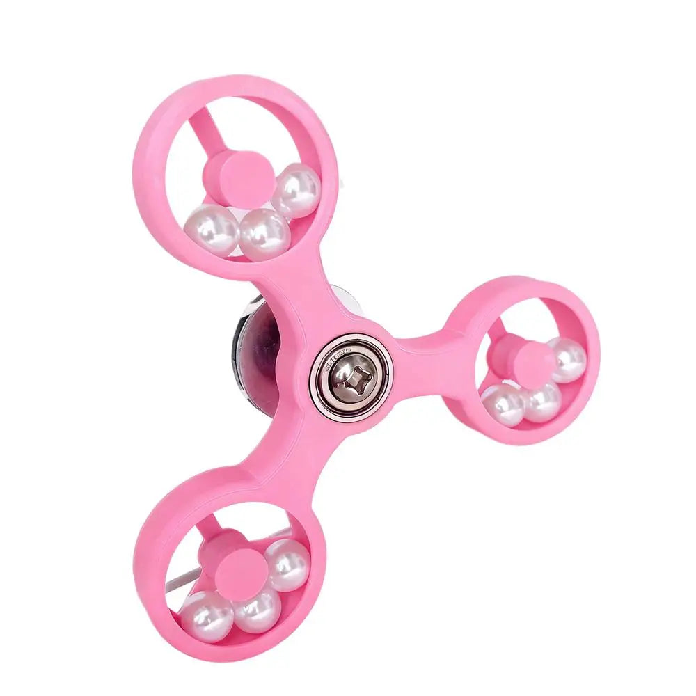 Pink fidget spinner with white beads on a white background