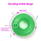 Green dog toy with spiky texture and sounding whistle design on a white background