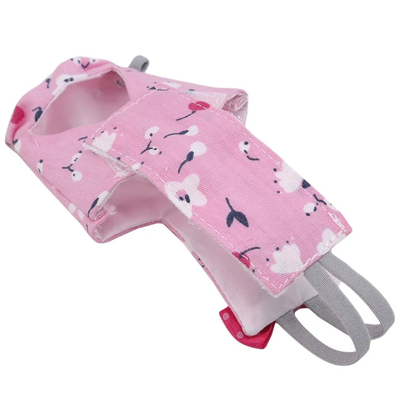 Pink dog muzzle with floral pattern on a white background