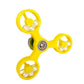 Yellow fidget spinner on a white background