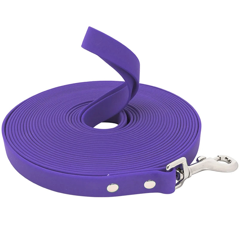 Purple dog leash with a silver clip on a white background
