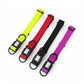 Four dog collars in yellow, red, black, and purple on a white background