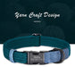 Teal and blue dog collar with a black metal buckle on a dark yarn background.
