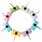 Colorful dog waste bags holder with bone design on a white background