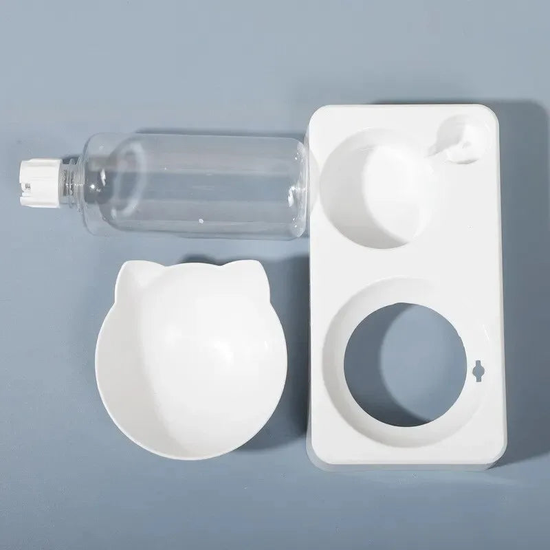 White cat-shaped bottle cap and clear bottle on a gray background