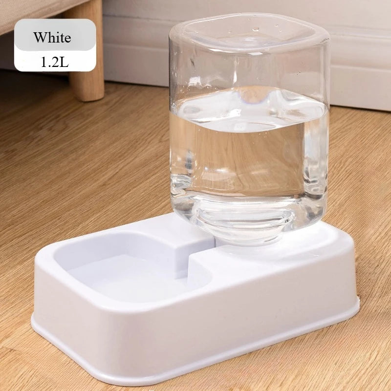 White pet water dispenser with a glass of water on a wooden floor.