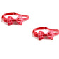 Two red bow ties with plaid patterns on a white background