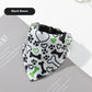 Dog bandana with black bones, green hearts, and paw prints on a white background