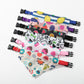 Set of colorful pet collars with various patterns on a white background
