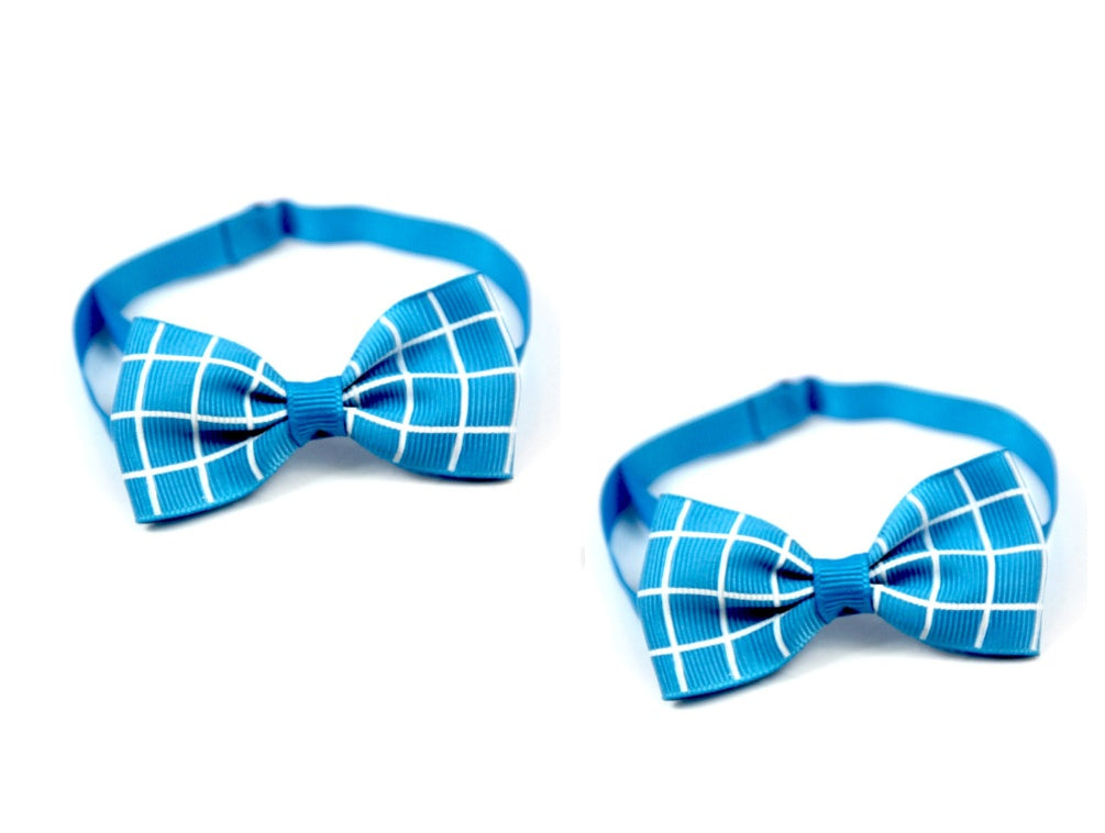 Two blue bow ties with white grid pattern on a white background